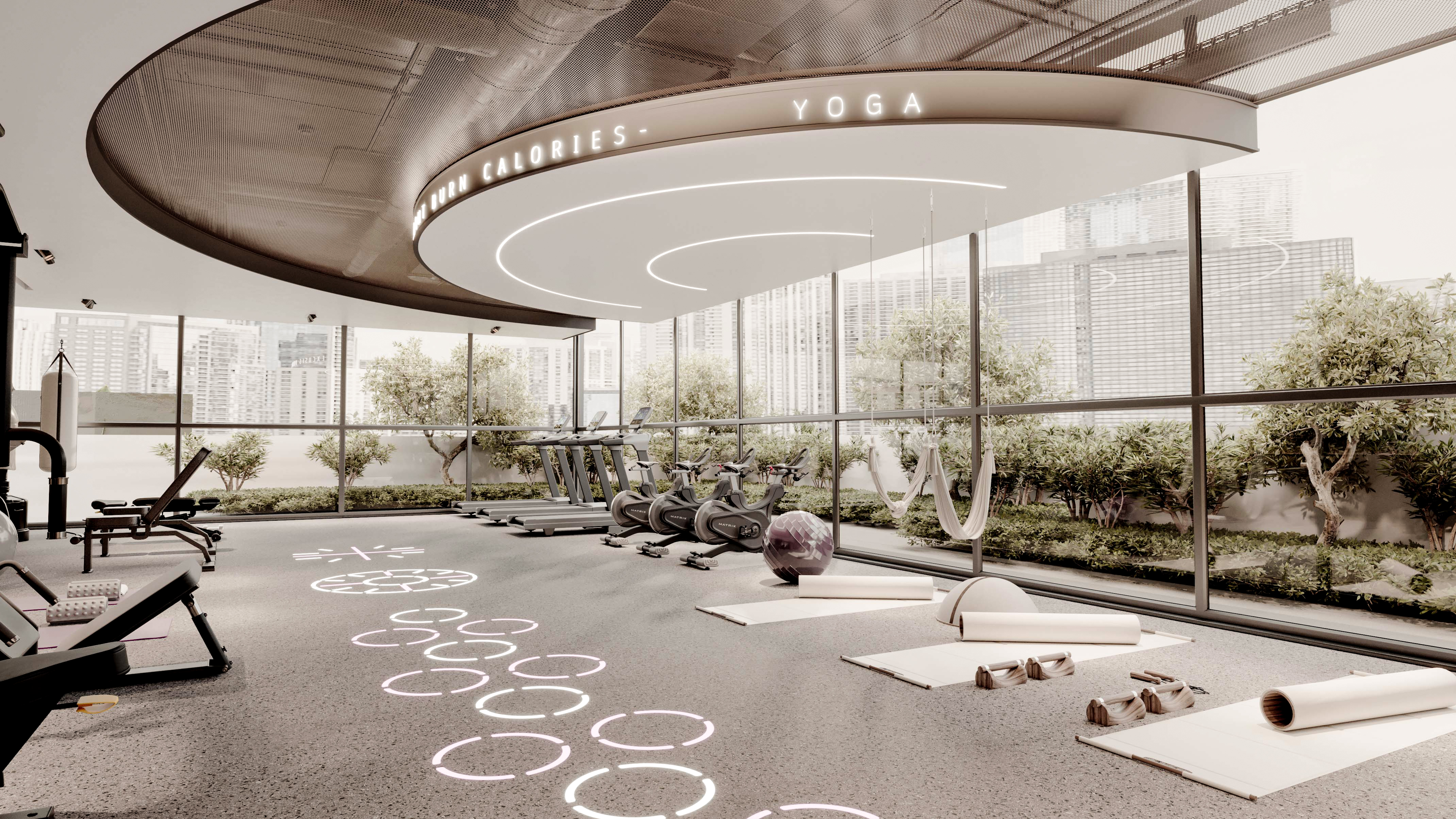 Le Blanc A modern fitness studio featuring yoga mats, exercise equipment, and large windows with greenery outside.